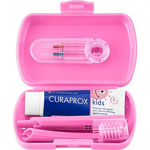 Дорожный набор Curaprox Kids розовый: зубная щетка Kids + детская зубная паста 10 мл + ершики 2 шт.