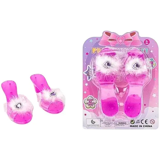 Туфлі з камінцем та страусиним пером