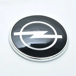 Емблема для Opel 72 мм пластикова чорна Xром Cкотч