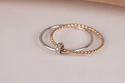 Каблучка з білого та жовтого золота з фіанітами 22 K-0038