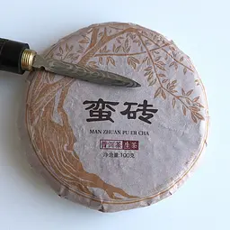 Шен пуер Man Zhuan Pu Er Cha 2021 року млинець 100 г