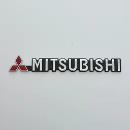 Емблема буквене позначення Mitsubishi чорний фон скотч 190 x 23 мм