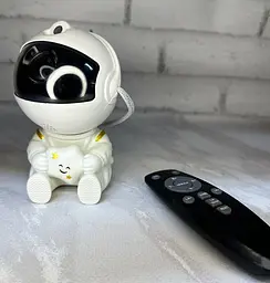 Нічник-проектор зоряного неба Астронавт Astronaut що сидить із зіркою космонавт з пультом 8 режимів - мініатюра 5