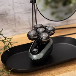 Роторна бритва для голови Remington Ultimate Series RX7 XR1600 чорно-зелений - мініатюра 10