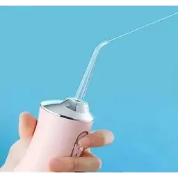 Іригатор акумуляторний Oral Irrigator S3J2 рожевий, з 3 насадками для чищення зубів - мініатюра 4
