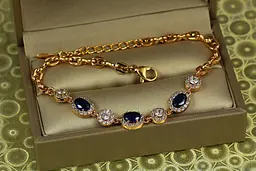 Браслет Xuping Jewelry малинки із чорними каменями з колами 17,5 см 7 мм золотистий