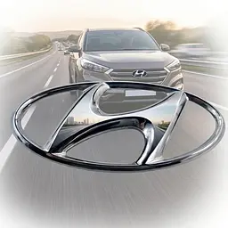 Емблема Hyundai 129х64 мм (2 напрямні зі скотч) Хром (Завод)