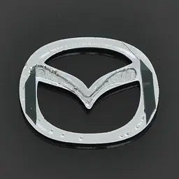 Емблема для Mazda 626 / 323 пластикова 63 x 50 мм - мініатюра 2
