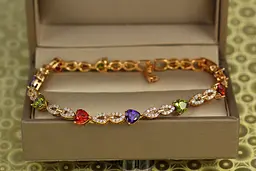 Браслет Xuping Jewelry Свято з темним різнобарвним камінням 21 см 5 мм золотистий