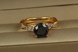 Кільце Xuping Jewelry косичка із чорним каменем р 19 золотисте