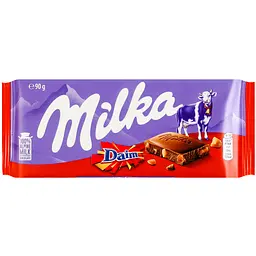 Шоколад молочний Milka зі шматочками хрумкої карамелі з мигдалем 90 г