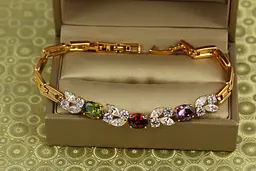 Браслет Xuping Jewelry Зіркопад з темними різнокольоровими каменями 19,5 см золотистий