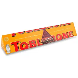 Шоколад Toblerone молочний з цукатами з апельсинової цедри, меленого імбиру і медово-мигдальною нугою 360 г - мініатюра 2