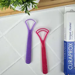 Набір скребків для язика Curaprox (рожевий та фіолетовий), 2 шт