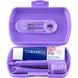 Дорожній набір Curaprox Kids фіолетовий: зубна щітка Kids + дитяча зубна паста 10 мл + йоршики 2 шт.