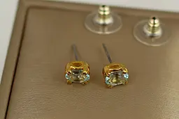 Сережки No Name гвоздики блакитний топаз 7 мм золотисті