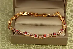 Браслет Xuping Jewelry Мозаїка з червоними каменями 17 см 6 мм золотистий