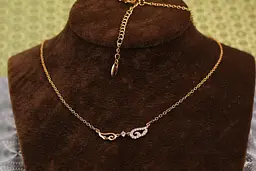 Набір Xuping Jewelry ланцюг із кулоном два крила 45 см добір 5 см золотистий