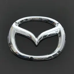 Емблема для Mazda 626 / 323 пластикова 63 x 50 мм