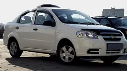 Дефлектор капоту мухобійка Chevrolet Aveo 06-11 / ЗАЗ Vida седан 11- Темний