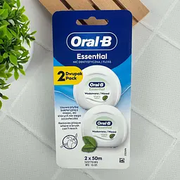 Зубна нитка Oral-B Essential Floss Mint вощена м’ятна для очищення міжзубних проміжків, 2x50 м