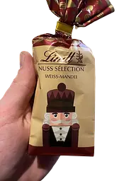 Шоколадні цукерки з мигдалем Lindt Nuss Selection Weiss Mandel 100 г - мініатюра 4
