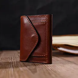 Стильний чоловічий гаманець у три складання Grande Pelle 16786 коричневий - мініатюра 9