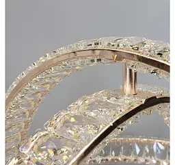 Підвісна світлодіодна люстра-сфера Artlight 569/600GD золота з кришталевими кільцями, що перетинаються, пультом і диммером - мініатюра 7