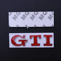 Емблема напис GTI скотч 3М 75 мм металева Польща