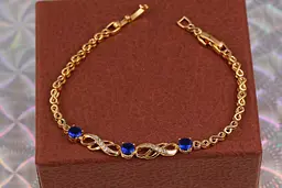 Браслет Xuping Jewelry вісімки з трьома круглими синіми каменями у центрі 19 см 6 мм золотистий