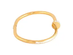 Браслет XUPING Нержавіюча сталь 14К "Цвях з написом Cartier та кристаллами" ø6см (350357) - мініатюра 2