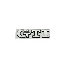 Емблема напис GTI для Volkswagen біла з чорною окантовкою 79х23 мм метал (на скотчі)