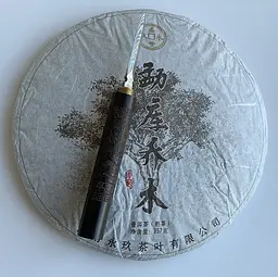 Шу пуер Meng Hai Qiao Mu 2015 року млинець 357 г