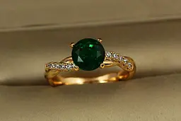 Кільце Xuping Jewelry косичка із зеленим каменем р 17 золотисте