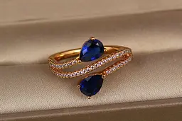 Кільце Xuping Jewelry зустрічні краплі із синіми каменями р 19 золотисте