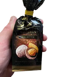 Шоколадні цукерки з мигдалем Lindt Weihnachtsmandeln Edelbitter 100г - мініатюра 3