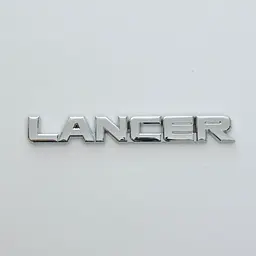 Емблема буквене позначення Lancer скотч 143 x 20 мм