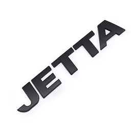 Емблема напис JETTA Пластик 132Х22 мм Чорна на скотчі (Завод)