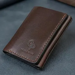 Зручний чоловічий гаманець у три складання Grande Pelle 16787 темно-коричневий - мініатюра 1