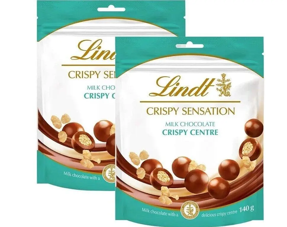 Шоколадні кульки Lindt CRISPY SENSATION Milk Chocolate Crispy Centre Pouch 140г - фото 2