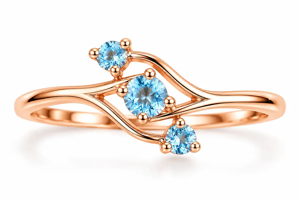 Жіноча золота каблучка Jewellery Continent з трьома блакитними топазами 21.5 (К-0925)