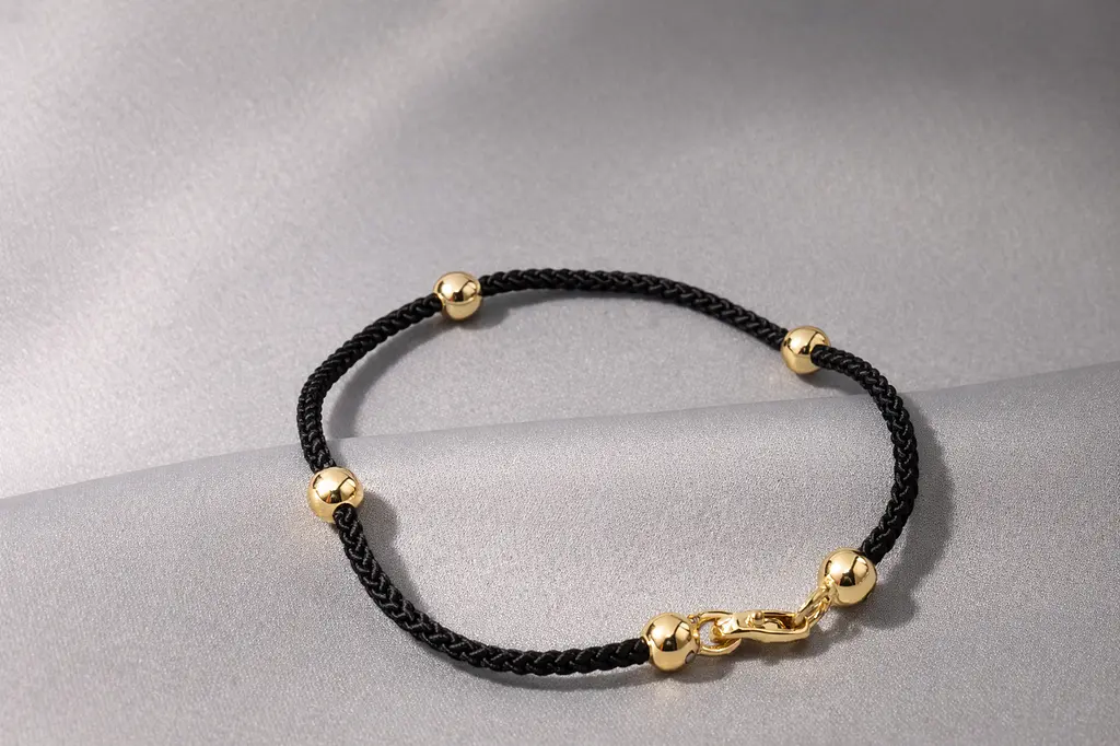 Стильний браслет із жовтого золота на чорному шовковому шнурі BR-0361 19.5 - фото 3