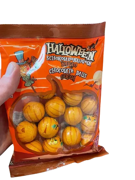 Шоколадні цукерки Halloween Pumpkin Milk Chocolate Balls 200г - фото 6
