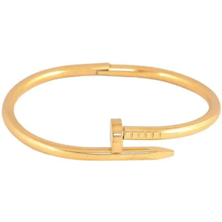 Браслет XUPING Нержавіюча сталь 14К "Цвях з написом Cartier" ø6см (350375)