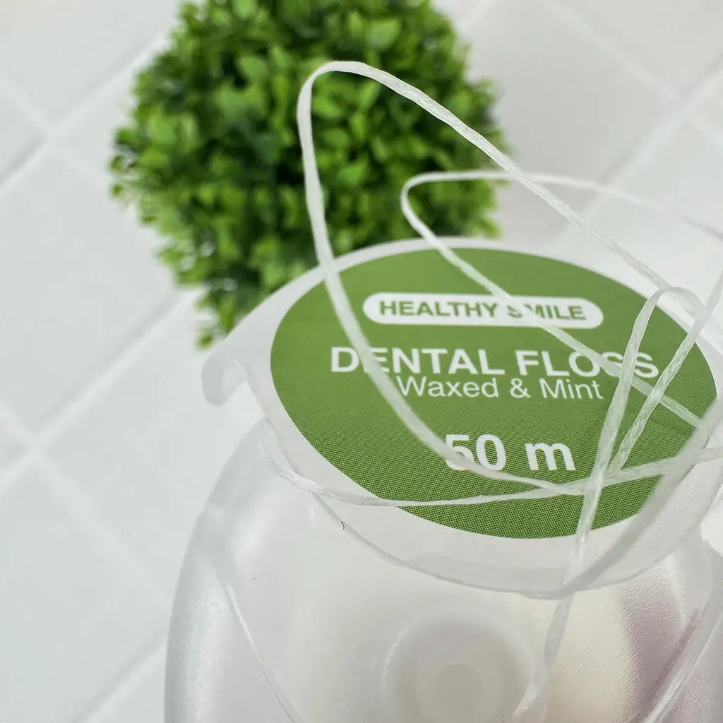 Вощена зубна нитка Healthy Smile зі смаком м'яти, 50 м - фото 2