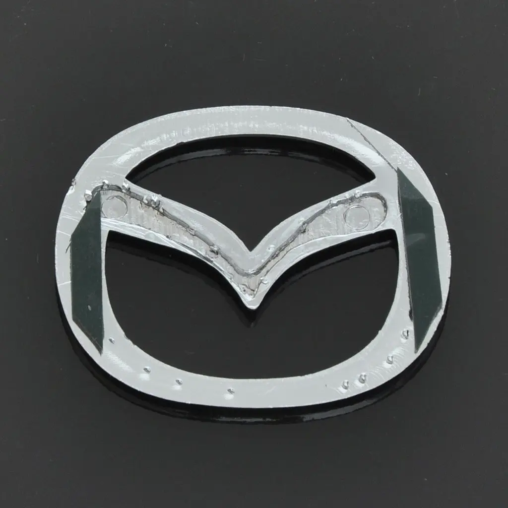Емблема для Mazda 626 / 323 пластикова 63 x 50 мм - фото 2