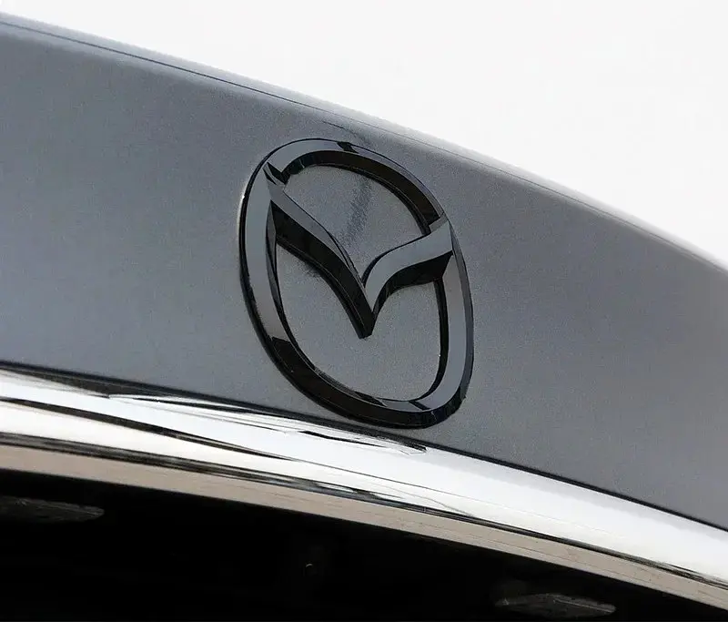 Емблема решітки Mazda Чорна 125×100мм пластик (на скотчі та з 2 напрямними) (вир-во Завод) CH - фото 3
