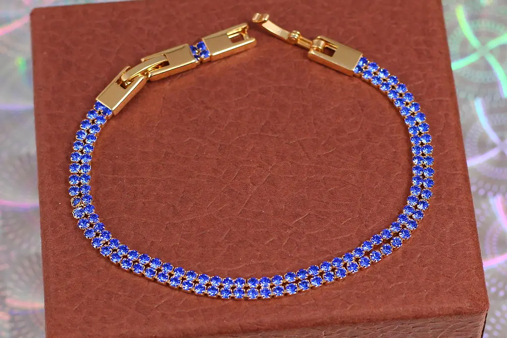 Браслет Xuping Jewelry дві доріжки із синіх фіанітів 19 см 4 мм золотистий