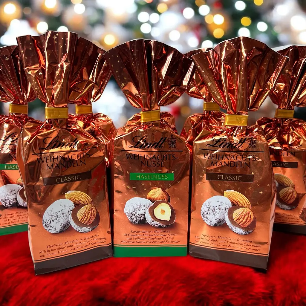 Шоколадні цукерки з фундуком Lindt Weihnachts Nusse Haselnuss 100г - фото 4