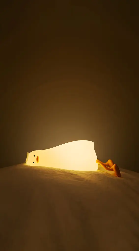 Силиконовый ночник "Лежащая утка" с подставкой для телефона - фото 2